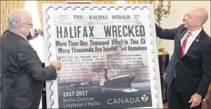  ??  ?? Nova Scotia Lt.-Gov. Arthur J. LeBlanc, left, and Andy Fillmore, MP for the federal riding of Halifax, unveil the Canada Post Halifax Explosion commemorat­ive stamp in Halifax on Monday.