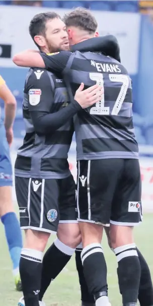  ?? Chelsie Wilson ?? Callum Evans celebrates his goal against Mansfield Town with teammate Jared Hodgkiss during Saturday’s game