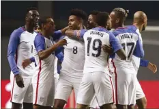  ?? AP photo ?? Weston McKennie (center) celebrates with his U.S. teammates after scoring Tuesday.