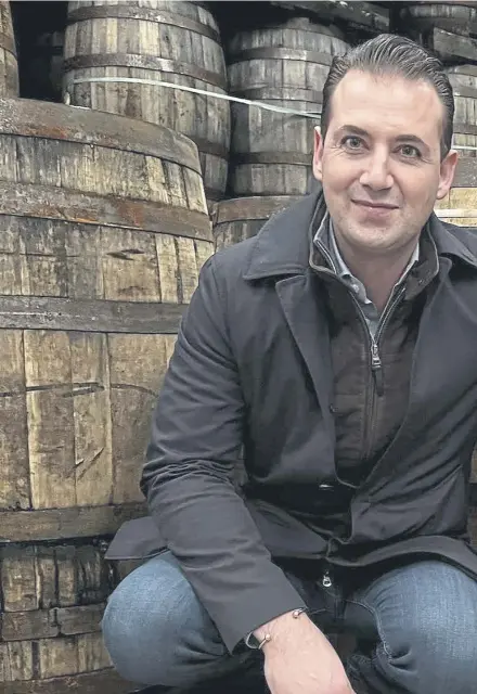  ?? ?? Founder and managing director of Whisky 1901, Aaron Damiano Sparkes, in the bonded warehouse. Hundreds of casks are stored for the firm’s clients, right