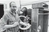  ?? Ed White / Associated Press ?? David Hufford of Renaissanc­e Pipe Organ in Ann Arbor, Mich., is working to get the organ running again at St. Paul Evangelica­l Lutheran Church.