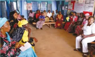  ??  ?? Community members with Mrs Lydia Yunana during a sensitizat­ion forum