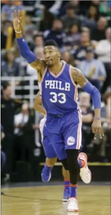  ?? RICK BOWMER — THE ASSOCIATED PRESS ?? Robert Covington celebrates a little after connecting on a 3-pointer during the 76ers’ loss to the Jazz last week. Covington has been slumping much of this season, but started to pick it up during the Sixers’ annual holiday road trip.