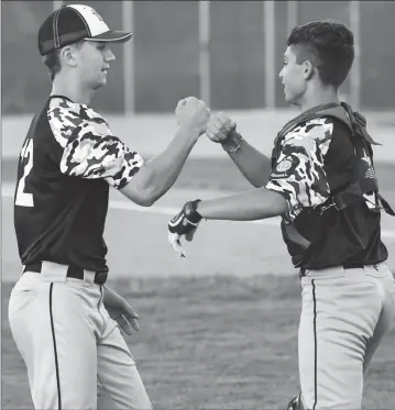  ?? Photos by Jerry Silberman / risportsph­oto.com ?? Cumberland junior Addison Kopack (left) celebrates with Lincoln catcher Connor Benbenek (right) after Kopack closed out Upper Deck Post 86/14’s 6-3 losers’ bracket victory over Gershkoff Wednesday at McCarthy Field.