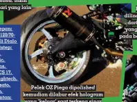  ??  ?? Pelek OZ Piega dipolished kemudian dilabur efek hologram yang ‘keluar’ saat terkena sinar
Bak kopling dilindungi cover dari GB Racing yang menempel pada baut Pro-bolt emas data Modifikasi Pelek: OZ Piega, Ban depan: Pirelli Diablo Rosso III 120/7017, Ban belakang: Pirelli Dialo Rosso III 160/60-17, Footstep: WR3, Monosok: Ohlins, Quickshift­er: Translogic, Steering damper: Ohlins, Master rem: Brembo RCS 17, Tabung minyak rem: Lightech, Handle kopling: Accossato, Race switch: Accossato, Preload: WR3, Gas spontan: Active, Windshield: Hot Bodies, Engine cover: GB Racing, Engine guard: WR3, Knalpot: Akrapovic, Selang rem: Hel, Cakram depan: Brembo, Kaliper depan: Brembo 4P, Braket kaliper: WR3, Kaliper belakang: Brembo 2P, Spion: ZX-10R, Radiator: B’pro, Tank pad: Harris, Paddock spool: WR3, Filter udara: Sprint Filter, ECU: Remap