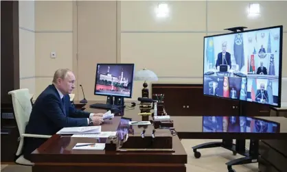  ?? Photograph: Alexei Nikolsky/Sputnik/Kremlin POOL/EPA ?? Vladimir Putin attends a Collective Security Council virtual meeting.