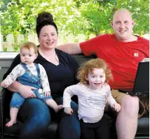  ??  ?? BALANCING ACT: Ruth and Gary O’Sullivan with their children Mia and baby Zoe. Photo: Frank McGrath