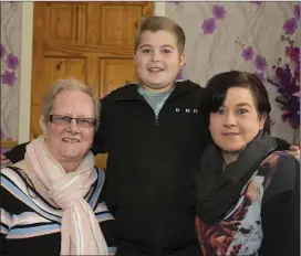  ??  ?? 13-year-old Darragh Power who has Cystic Fibrosis photograph­ed at his home with his mother Jacinta and Angela Hennessy who set up the Go Fund Me page.