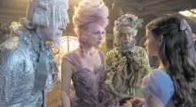  ??  ?? COSTUME PARTY: Richard E. Grant, left, stars with Keira Knightley, center, in ‘The Nutcracker and the Four Realms.’