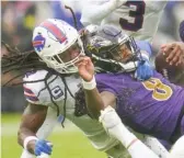  ?? JULIO CORTEZ/AP ?? Tremaine Edmunds (bringing down Lamar Jackson) prides himself on his effort.