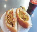  ?? ROGER NAYLOR/SPECIAL FOR THE REPUBLIC ?? The Sonoran dogs at El Guero Canelo in Tucson won a prestigiou­s James Beard Award in 2018.