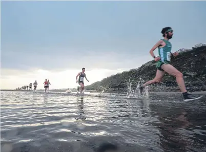  ??  ?? Intrepid runners in the Black Rock 5 road and beach race, including Kinghorn Co-op staff Colin Currie and Calum McLaren, were praised by Kinghorn Play Parks chairman Roy Mackie.