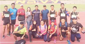  ??  ?? CONVINCING DISPLAYS ... the medallists for Sabah with Ali (5th left, back) and Dzulfikar (4th right, back) at the Perak All-Comers I Athletics Championsh­ip in Lumut on Sunday.