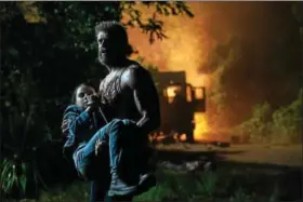  ?? PHOTO BEN ROTHSTEIN COURTESY OF 20TH CENTURY FOX HOME ENTERTAINM­ENT ?? Hugh Jackman as Logan/Wolverine and Dafne Keen as Laura in “Logan.”