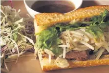  ?? Photo: Craig Fujii ?? The Pig & the Lady’s Pho French Dip Bahn Mi.