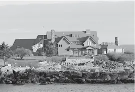  ?? Associated Press ?? ■ The American flag flies at half-staff in honor of President George H.W. Bush at Walker’s Point, the Bush’s summer home in Kennebunkp­ort, Maine.