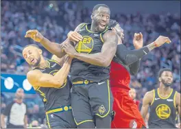  ?? KARL MONDON — BAY AREA NEWS GROUP, FILE ?? Warriors teammates Stephen Curry and Draymond Green collide fighting for a rebound against the Trail Blazers on Nov. 26 at Chase Center in San Francisco.