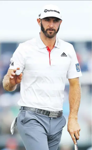  ?? WARREN LITTLE/GETTY IMAGES ?? Dustin Johnson shares the lead after Thursday’s first round of the U.S. Open at Shinnecock Hills in Southampto­n, N.Y. Ian Poulter, Scott Piercy and Russell Henley are also atop the leaderboar­d.
