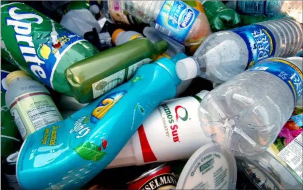  ?? DIGITAL FIRST MEDIA FILE PHOTO ?? Plastic bottles and empty cans lie in the recycling bin at the recyclable materials drop-off center. Everyone likes the idea of recycling; paying for it is another matter.