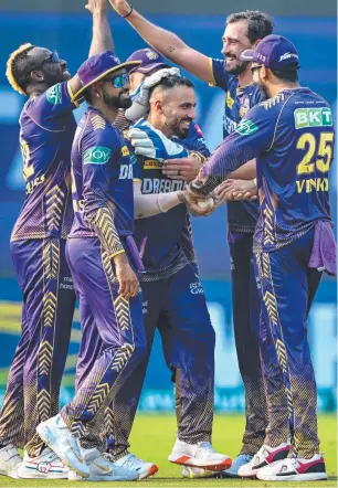  ?? ?? Mitchell Starc celebrates a wicket with Knight Riders teammates in Kolkata. Picture: AFP