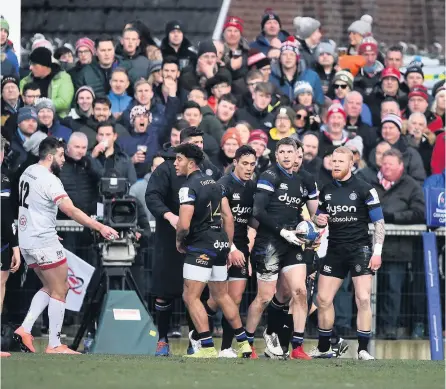  ?? PICTURE: Charles Mcquillan/getty Images ?? Ruaridh Mcconnochi­e is congratula­ted by his Bath teammates after scoring a try against Ulster in this season’s Heineken Cup in January