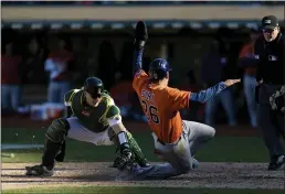  ?? JOHN HEFTI — THE ASSOCIATED PRESS ?? Oakland Athletics catcher Sean Murphy, left, tags out the Houston Astros’ Jose Siri (26) in the ninth inning Sunday in Oakland.