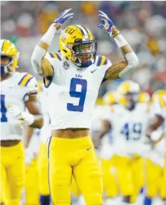  ?? AP FILE PHOTO/ROGER STEINMAN ?? LSU Tigers safety Grant Delpit signals to the crowd as he runs onto the field before a game against the Miami Hurricanes on Sept. 2. No. 12 LSU faces No. 7 Auburn today at Auburn, Ala.