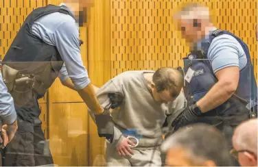  ?? John Kirk-Anderson / AFP via Getty Images ?? White supremacis­t Brenton Tarrant attends his third day in court in Christchur­ch, New Zealand.