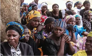  ??  ?? Parents and relatives attend a commemorat­ion five years after their girls were abducted by Boko Haram Jihadists group outside the Chibok Local Government. — AFP photo