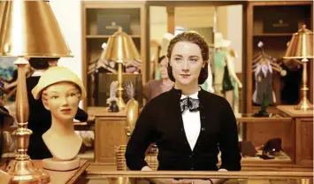  ??  ?? Saoirse Ronan as Eilis in a scene from the film Brooklyn.