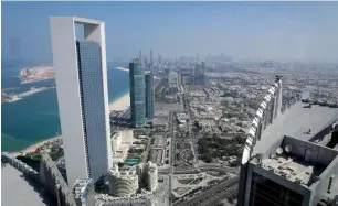  ?? — AFP ?? S&amp;P expects Abu Dhabi and Kuwait to maintain liquid assets above 100 per cent of GDP.