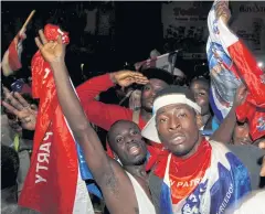  ??  ?? VICTORY CELEBRATIO­NS: Supporters of Ghanaian newly elected president Nana Akufo-Addo of the opposition New Patriotic Party celebrate in Accra.