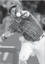  ??  ?? ANGELS FIRST BASEMAN Jefry Marte drops a popup in the ninth, setting up Twins’ rally.