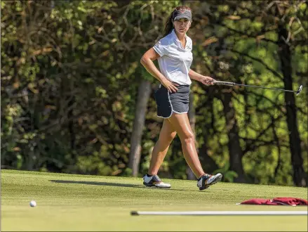  ?? CONTRIBUTE­D BY STEPHEN SPILLMAN ?? Texas senior Sophia Schubert studies her shot on the eighth hole Monday during the NCAA Austin Regional at the University of Texas Golf Club. Her first-round 69 helped put the Longhorns atop the team standings by three strokes.