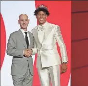  ?? Brad Penner-usa today sports ?? Jalen Johnson poses with NBA commission­er Adam Silver after being selected as the number twenty overall pick by the Atlanta Hawks in the first round of the 2021 NBA Draft at Barclays Center on July 29.