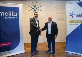  ?? ?? Malcolm Briffa, chief officer Business and IoT at Melita (left), shakes hands with Malta Enterprise CEO Kurt Farrugia