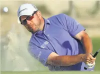  ??  ?? SANDY MAN Ramsay exits a bunker during his Doha round