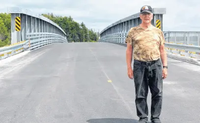  ?? CHRIS CONNORS • CAPE BRETON POST ?? Mira Gut resident Don Burns said a new bridge has reconnecte­d the communitie­s on both sides of the Mira River.