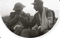  ??  ?? ABOVE: A wounded British soldier shares a cigarette with a wounded German prisoner during the Battle of the Mareth Line, c.22-24 March 1943