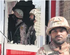  ??  ?? Pakistani troops in the compound of the Chinese consulate in Karachi, Pakistan. The gunmen stormed the compound yesterday.