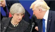  ?? THE ASSOCIATED PRESS ?? President Donald Trump, right, speaks to British Prime Minister Theresa May in a working dinner meeting during the NATO summit of heads of state and government at the NATO headquarte­rs in Brussels on Thursday.