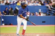  ?? Jon Blacker / Associated Press ?? Toronto Blue Jays’ Vladimir Guerrero Jr. watchers his two-run home run, which also scored Bo Bichette, clear the wall in the third inning against the Boston Red Sox Monday in Toronto.