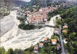  ?? SDIS 06 ?? HOMES are threatened amid f looding Sunday near La Vesubie in France. Rescuers were searching for eight missing people and aiding those stranded in villages.