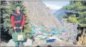  ??  ?? Nirma Devi, the lone accredited social health activist at Malana (in the backdrop), says that she will also take the vaccine along with the villagers.