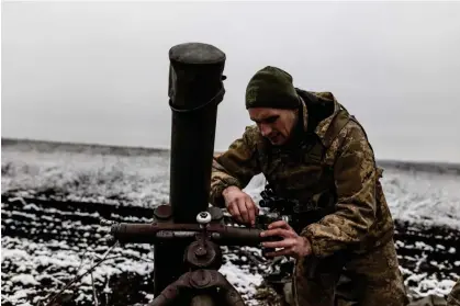  ?? ?? A Ukrainian soldier prepares a mortar in Donetsk Oblast, Ukraine, on 9 February. Photograph: Diego Herrera Carcedo/Anadolu via Getty Images