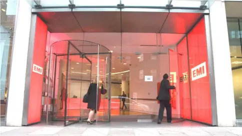  ??  ?? Employees enter the EMI Music headquarte­rs in London on Feb 2, 2011. — WP-Bloomberg photo