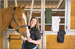  ?? Allen J. Schaben Los Angeles Times ?? ALEXA STANFILL, a law school graduate, seen with her horse Cota, cofounded Esprit Equestrian Wear, which sells riding pants and other items.