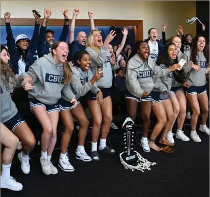  ?? PHOTO BY MILKA SOKO ?? California Baptist University basketball players react after finding out they will play UCLA in the first round of the NCAA Tournament.