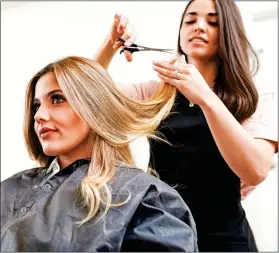  ??  ?? CUTS: The jobs of many hairdresse­rs are ‘acutely vulnerable’ if lockdowns persist