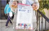  ??  ?? Asylum seekers arriving at the shelter have a plastic bag for their belongings at Templo Embajadore­s de Jesus on Thursday.